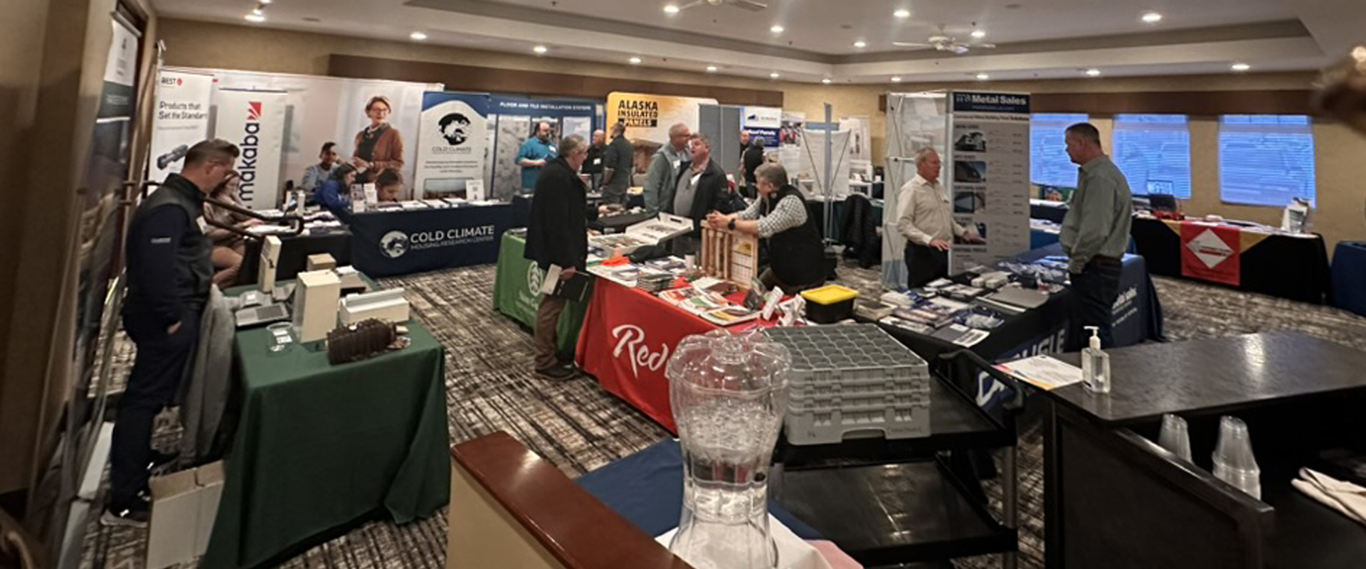Trade show event showcasing companies with booths, networking, and product demonstrations in a bustling atmosphere.